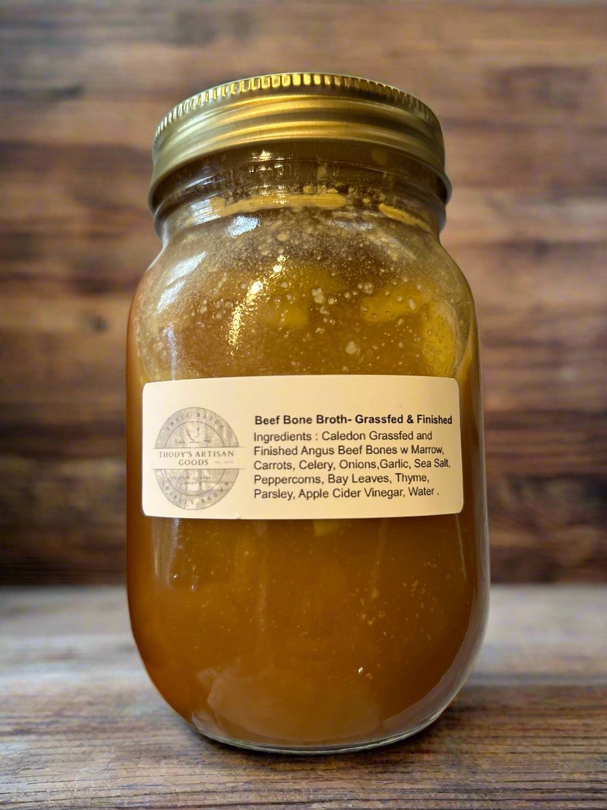 Jars of Grass Fed Beef Bone broth with labels on jars